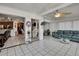 Open living area with tile flooring, fan, and natural light at 279 Maple Ave, Palm Harbor, FL 34684