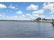 Wide view of the water shows a residential waterfront community in the distance at 279 Maple Ave, Palm Harbor, FL 34684