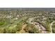 Aerial view of neighborhood with golf course and tree coverage at 3013 Appleblossom Trl, Spring Hill, FL 34606