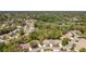 A beautiful aerial view of a lovely neighborhood with mature trees and landscaping surrounding a golf course at 3013 Appleblossom Trl, Spring Hill, FL 34606
