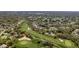 Aerial view of golf course community with lush greenery, well-manicured lawns and beautiful landscaping at 3013 Appleblossom Trl, Spring Hill, FL 34606