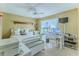 Bedroom featuring a work station, a comfortable bed, a ceiling fan, and natural light for a cozy and functional space at 3013 Appleblossom Trl, Spring Hill, FL 34606