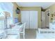 Bedroom with a work desk, a view to the outdoors, and functional closet space for all your storage needs at 3013 Appleblossom Trl, Spring Hill, FL 34606