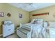 Bedroom with a cozy bed and neutral colors, complimented by ample lighting and a serene atmosphere at 3013 Appleblossom Trl, Spring Hill, FL 34606