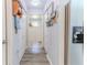 Hallway with built-in storage and bead board at 3013 Appleblossom Trl, Spring Hill, FL 34606