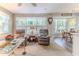 Comfortable living room area that features large windows with lots of natural light and easy access to the dining room at 3013 Appleblossom Trl, Spring Hill, FL 34606