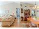 View of the living room and dining area with hardwood floors and vaulted ceilings at 3013 Appleblossom Trl, Spring Hill, FL 34606