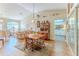 Open-concept living and dining area with wood floors at 3013 Appleblossom Trl, Spring Hill, FL 34606