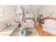 Inviting living room boasts hardwood floors, vaulted ceilings, and ample natural light at 3013 Appleblossom Trl, Spring Hill, FL 34606