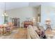 Open-concept living room and dining area with vaulted ceilings and hardwood floors at 3013 Appleblossom Trl, Spring Hill, FL 34606