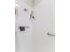 Close up of the shower with safety bars, shelf, and shower head for accessibility and convenience at 3013 Appleblossom Trl, Spring Hill, FL 34606