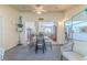 Inviting sunroom with ample seating and sliding glass doors providing seamless access to the outdoors at 3013 Appleblossom Trl, Spring Hill, FL 34606