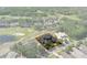 Aerial image of the property, with highlighted boundaries, nestled in a golf course community at 3026 Wentworth Way, Tarpon Springs, FL 34688