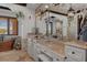 Opulent bathroom with double vanities, granite counters, soaking tub, and plantation shutters for privacy at 3026 Wentworth Way, Tarpon Springs, FL 34688