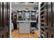 Walk-in closet with custom shelves, drawers, and closet rod for optimal storage at 3026 Wentworth Way, Tarpon Springs, FL 34688
