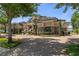 An upscale home with stone accents, manicured landscaping, and a brick driveway at 3026 Wentworth Way, Tarpon Springs, FL 34688
