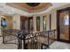Elegant foyer featuring custom iron railing, coffered ceiling with decorative medallion and views to the balconies at 3026 Wentworth Way, Tarpon Springs, FL 34688