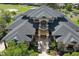 Stunning front exterior showcasing a stately entrance with stone accents and meticulous landscaping at 3026 Wentworth Way, Tarpon Springs, FL 34688