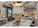 Gourmet kitchen with granite counters, custom cabinets, and stone backsplash at 3026 Wentworth Way, Tarpon Springs, FL 34688