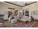 Spacious living room with hardwood floors and sectional sofa for a comfortable gathering space at 3026 Wentworth Way, Tarpon Springs, FL 34688