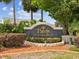 Entrance to The Palms at Seven Hills, a beautiful community with lush landscaping at 305 Royal Palm Way, Spring Hill, FL 34608