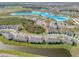 Aerial shot of a community with new homes and a large, beautiful lagoon at 31718 Blue Passing Loop, Wesley Chapel, FL 33545