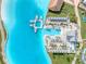 Beautiful aerial of a large lagoon with sun umbrellas, seating areas and floating platforms at 31718 Blue Passing Loop, Wesley Chapel, FL 33545