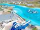 A large community lagoon featuring multiple beach areas, water activities and slides for endless entertainment at 31718 Blue Passing Loop, Wesley Chapel, FL 33545