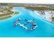 A sprawling community water park with interconnected water features, waterslides, and sandy beaches at 31718 Blue Passing Loop, Wesley Chapel, FL 33545