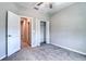 A well-lit bedroom with a neutral color scheme and closet offers ample storage at 31718 Blue Passing Loop, Wesley Chapel, FL 33545