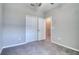 A well-lit bedroom features a neutral color scheme and a double-door closet for ample storage at 31718 Blue Passing Loop, Wesley Chapel, FL 33545