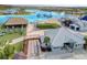 Community center with covered seating and a sandy volleyball court by the lagoon at 31718 Blue Passing Loop, Wesley Chapel, FL 33545