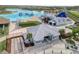 Close up aerial view of the building, outdoor eating areas and lagoon beyond at 31718 Blue Passing Loop, Wesley Chapel, FL 33545
