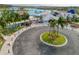 View of the community center entrance and surrounding lush landscaping at 31718 Blue Passing Loop, Wesley Chapel, FL 33545