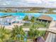 Community amenities include lagoon, beach access, seating areas, and playground at 31718 Blue Passing Loop, Wesley Chapel, FL 33545