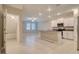 Bright, open-concept kitchen flows into the living area with an island and modern appliances at 31718 Blue Passing Loop, Wesley Chapel, FL 33545