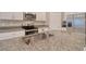 Close up of kitchen showcasing granite counters, stainless steel sink, and modern fixtures at 31718 Blue Passing Loop, Wesley Chapel, FL 33545