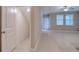 Open living space featuring tile flooring and ample natural light at 31718 Blue Passing Loop, Wesley Chapel, FL 33545