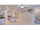Spacious living room featuring an open-concept design with modern finishes and tile flooring at 31718 Blue Passing Loop, Wesley Chapel, FL 33545