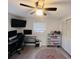 Bedroom with black desk, dual monitors, and shoe storage unit with many shoes at 3309 Bayport Dr, Holiday, FL 34691