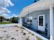Single story home featuring a covered porch area with brick and nice landscaping at 3309 Bayport Dr, Holiday, FL 34691