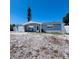 Charming single story home featuring a garage, blue paint and rock landscaping at 3309 Bayport Dr, Holiday, FL 34691