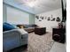 Bright and cozy living room area featuring comfortable seating, and stylish decor, creating an inviting space to unwind at 3309 Bayport Dr, Holiday, FL 34691