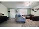 Bright living room with shutters, tile flooring, comfortable seating, and charming decor for a cozy atmosphere at 3309 Bayport Dr, Holiday, FL 34691