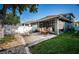 Charming backyard featuring string lights, an outdoor bar, and a cozy seating area at 3515 Albritton St, New Port Richey, FL 34655