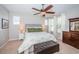Serene bedroom featuring a comfortable bed, ceiling fan, and a spacious dresser at 3515 Albritton St, New Port Richey, FL 34655