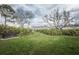 Peaceful community park featuring benches and walking path, surrounded by lush greenery at 3515 Albritton St, New Port Richey, FL 34655