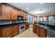 Modern kitchen with stainless steel appliances, including an oven, range, and plenty of counter space at 3515 Albritton St, New Port Richey, FL 34655