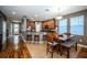 Open-concept kitchen with a breakfast bar, dining area, and seamless flow to the living space at 3515 Albritton St, New Port Richey, FL 34655