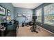 Home office or bonus room with neutral carpet and plenty of natural light at 3515 Albritton St, New Port Richey, FL 34655